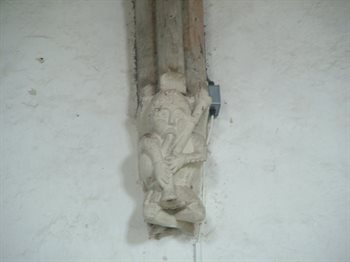 Medieval bagpiper corbel - copyright All Saints Little Staughton